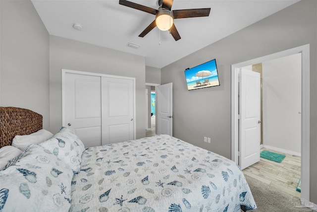 bedroom with a closet, ceiling fan, and light hardwood / wood-style flooring