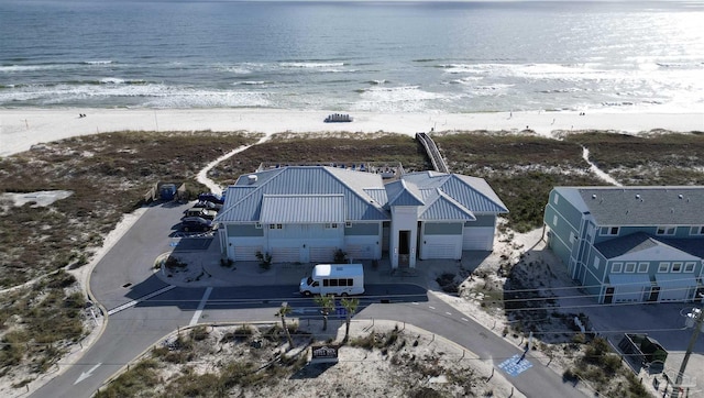 aerial view with a water view and a view of the beach