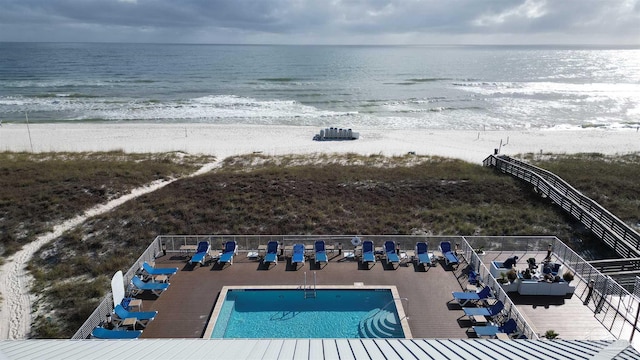 bird's eye view with a water view and a view of the beach