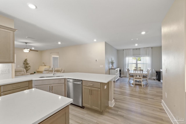 kitchen with ceiling fan, sink, light brown cabinets, dishwasher, and light hardwood / wood-style floors