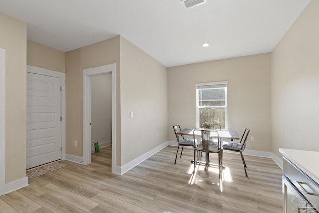 dining room featuring light hardwood / wood-style flooring