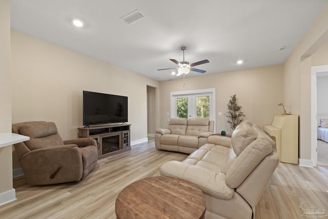 living room featuring french doors, light hardwood / wood-style flooring, and ceiling fan