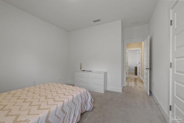 bedroom featuring light colored carpet