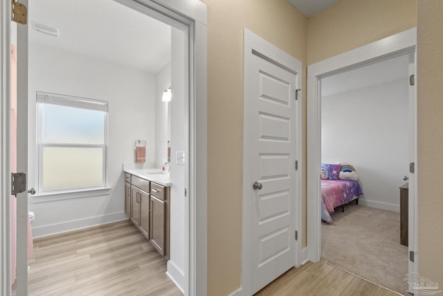 bathroom featuring hardwood / wood-style floors, vanity, and toilet