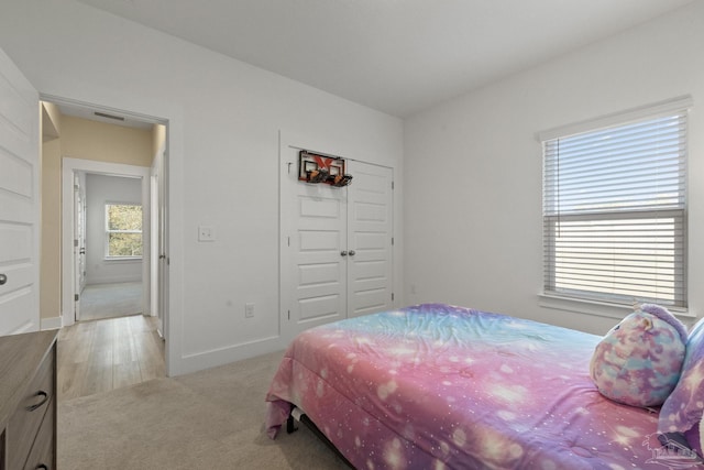 bedroom with light hardwood / wood-style flooring