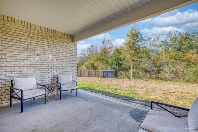 view of patio with a storage shed