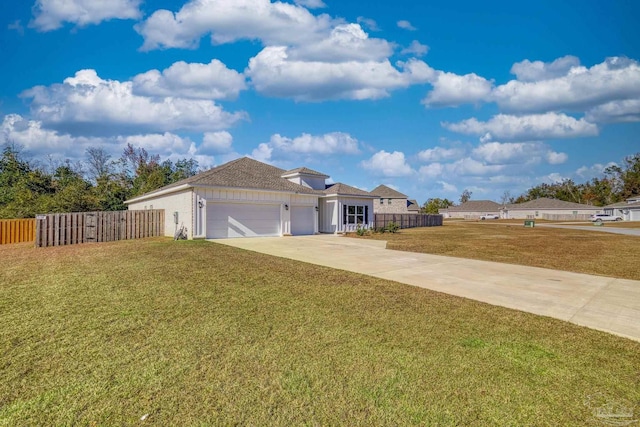 single story home with a front yard and a garage