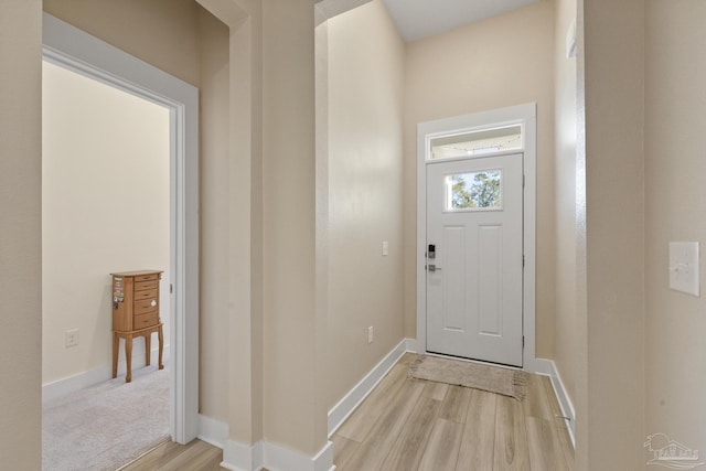 doorway with light wood-type flooring