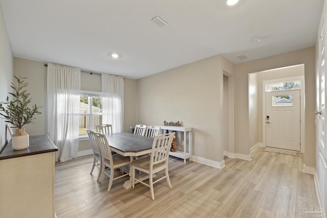 dining area featuring light wood-type flooring