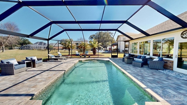 view of pool featuring outdoor lounge area, a patio, a lawn, and a lanai