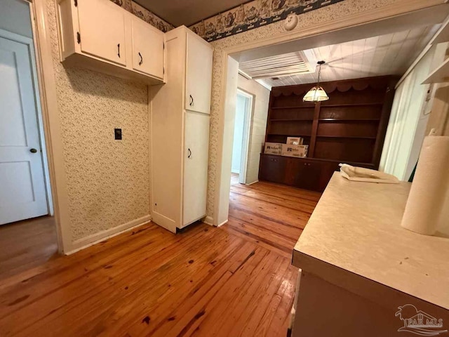 602 Coulter Ave, Cantonment, FL 32533 - laundry area featuring light wood-style floors, built in features, baseboards, and wallpapered walls