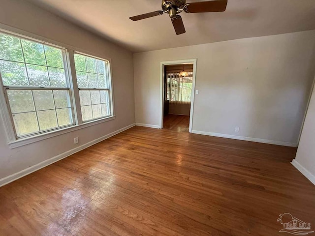 602 Coulter Ave, Cantonment, FL 32533 - unfurnished room with baseboards, wood finished floors, and ceiling fan