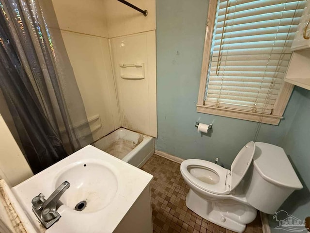 602 Coulter Ave, Cantonment, FL 32533 - full bath featuring toilet, shower / bath combination with curtain, vanity, baseboards, and tile patterned flooring