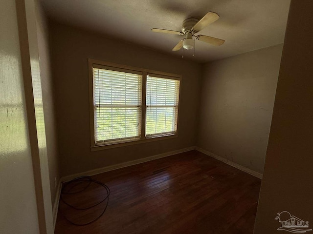 602 Coulter Ave, Cantonment, FL 32533 - empty room with dark wood-style flooring, baseboards, and a ceiling fan