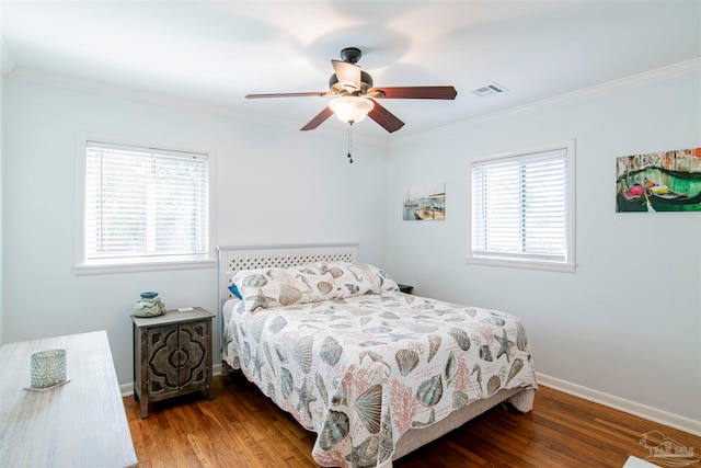 bedroom featuring ceiling fan, wood-type flooring, and ornamental molding