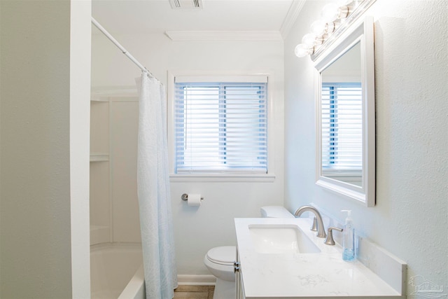 full bathroom featuring vanity, toilet, plenty of natural light, and crown molding