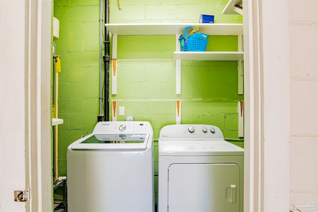 laundry room featuring washing machine and clothes dryer