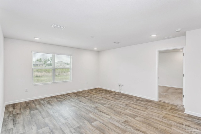 unfurnished room featuring light hardwood / wood-style flooring