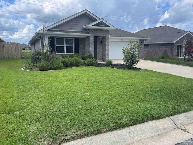 ranch-style house featuring a garage and a front yard