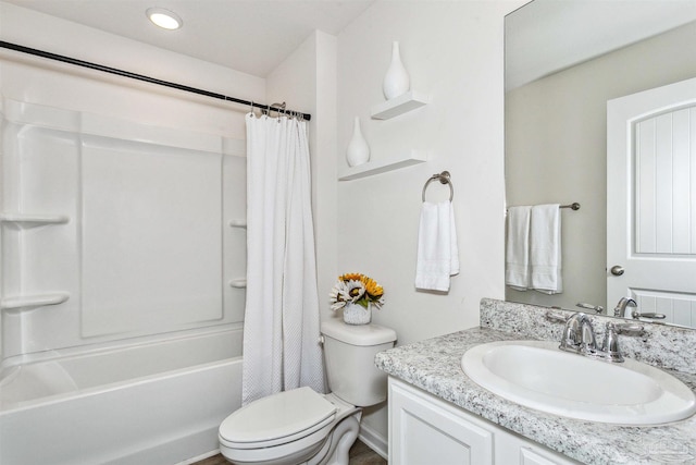 full bathroom featuring shower / tub combo with curtain, vanity, and toilet