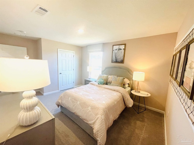 bedroom featuring visible vents, baseboards, and carpet flooring