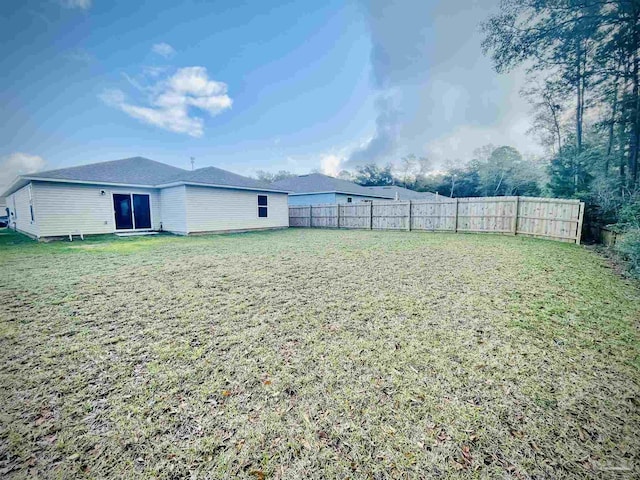 view of yard featuring a fenced backyard