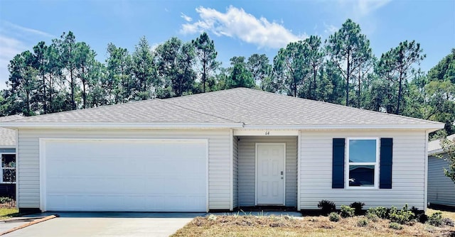 single story home featuring driveway, a garage, and roof with shingles