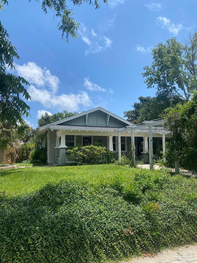 exterior space with a yard and a pergola