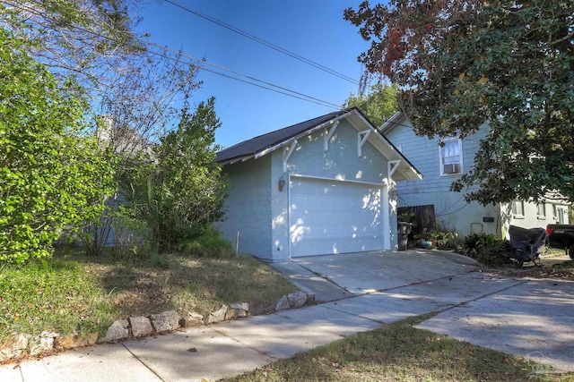 view of property exterior with a garage