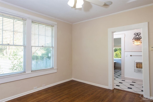 unfurnished room featuring ceiling fan, ornamental molding, dark hardwood / wood-style floors, and heating unit