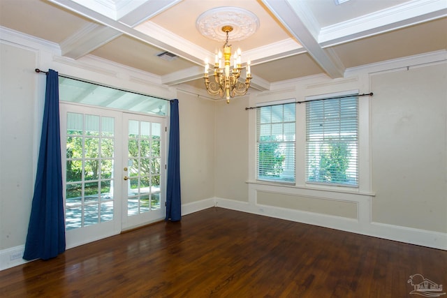 unfurnished room featuring coffered ceiling, a notable chandelier, plenty of natural light, and beamed ceiling