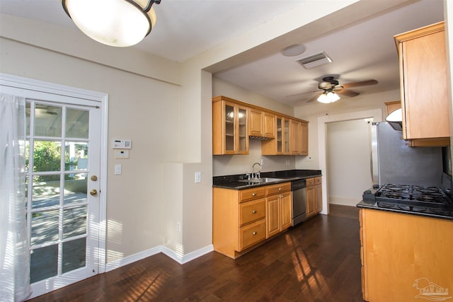 kitchen featuring dark wood-type flooring, sink, stainless steel dishwasher, ceiling fan, and black gas cooktop