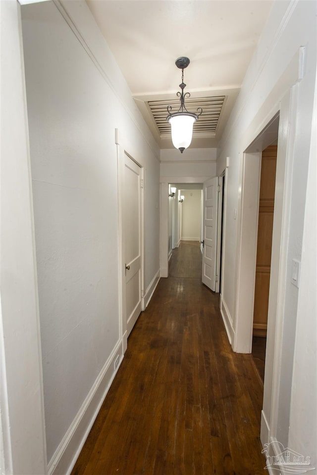 corridor with dark wood-type flooring