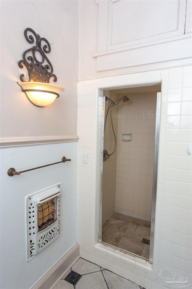 bathroom featuring a shower with door and tile patterned floors