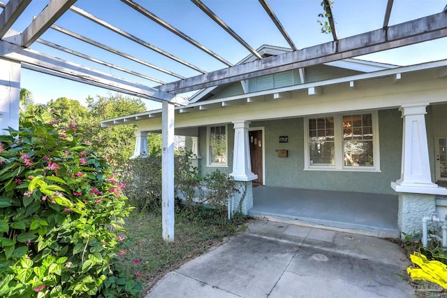 doorway to property with a porch