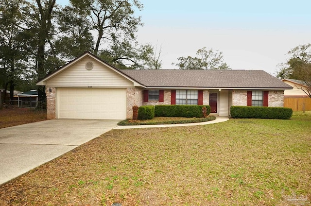 single story home with driveway, roof with shingles, an attached garage, a front yard, and brick siding