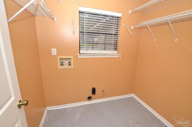 clothes washing area featuring gas dryer hookup, laundry area, washer hookup, and baseboards