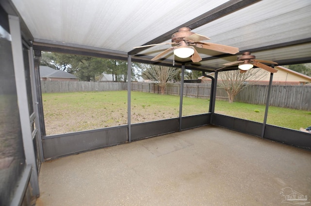 unfurnished sunroom with plenty of natural light and ceiling fan