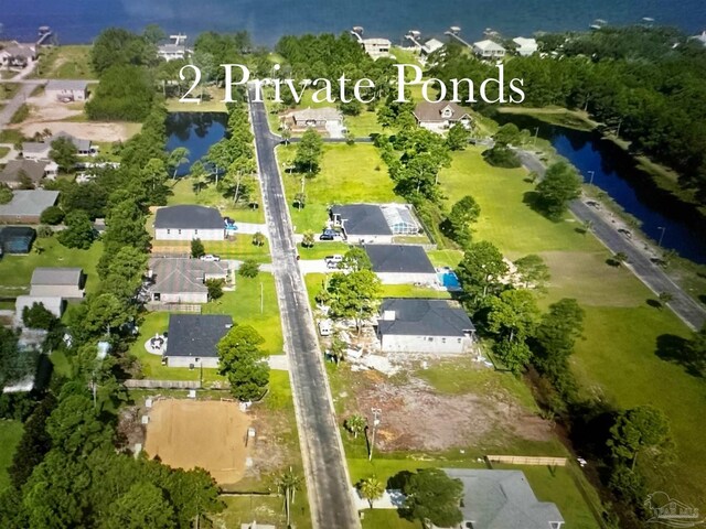 aerial view with a water view and a residential view