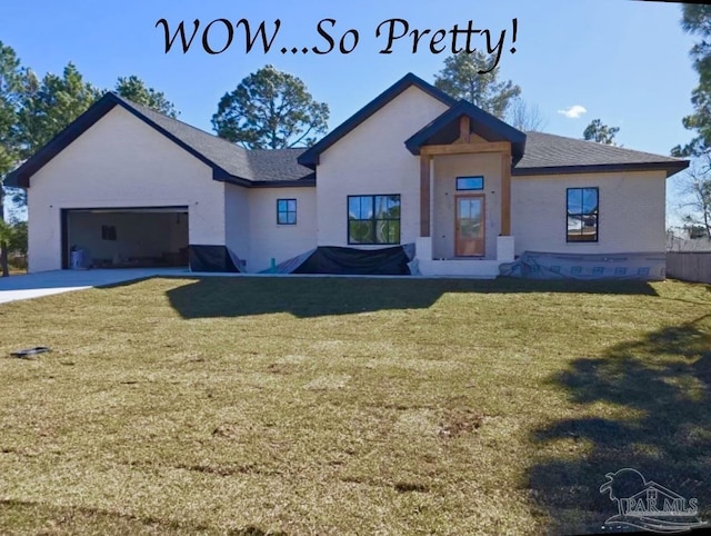 view of front facade featuring a garage and a front lawn