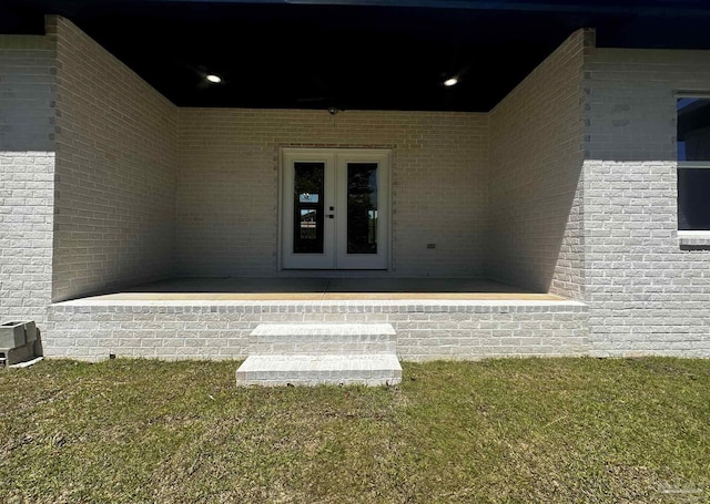 1181 Adrian Way, Milton, FL 32583 - view of exterior entry with french doors and brick siding
