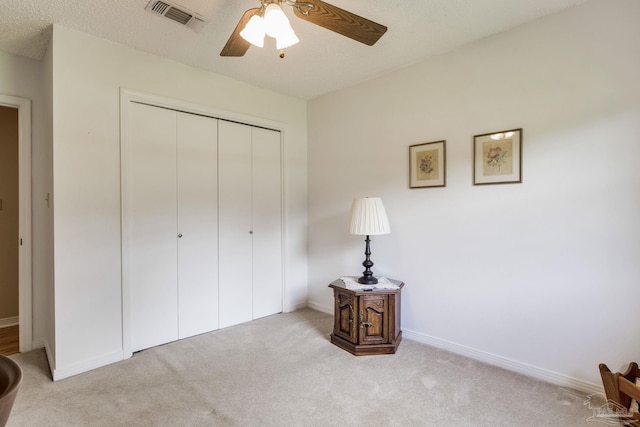 6028 Laurelwood Dr, Milton, FL 32570 - unfurnished bedroom with carpet flooring, a closet, baseboards, and a ceiling fan