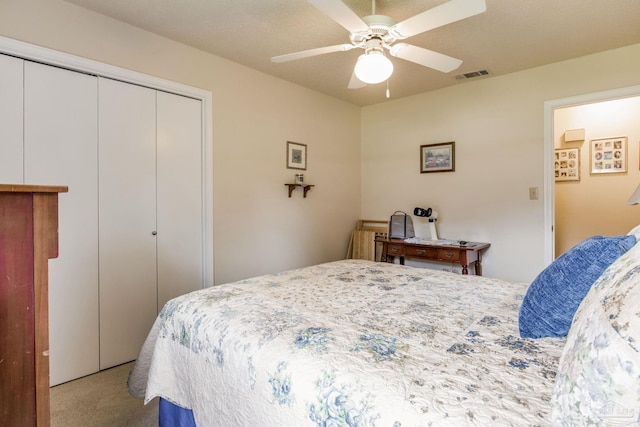 6028 Laurelwood Dr, Milton, FL 32570 - bedroom with light colored carpet, a closet, and a ceiling fan