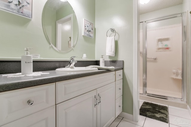 6028 Laurelwood Dr, Milton, FL 32570 - bathroom with vanity, a shower stall, and tile patterned flooring