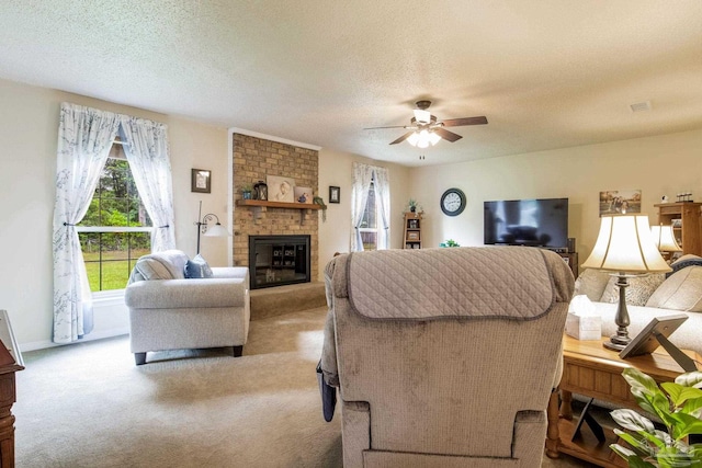 6028 Laurelwood Dr, Milton, FL 32570 - living area with carpet flooring, a ceiling fan, a fireplace, a textured ceiling, and baseboards