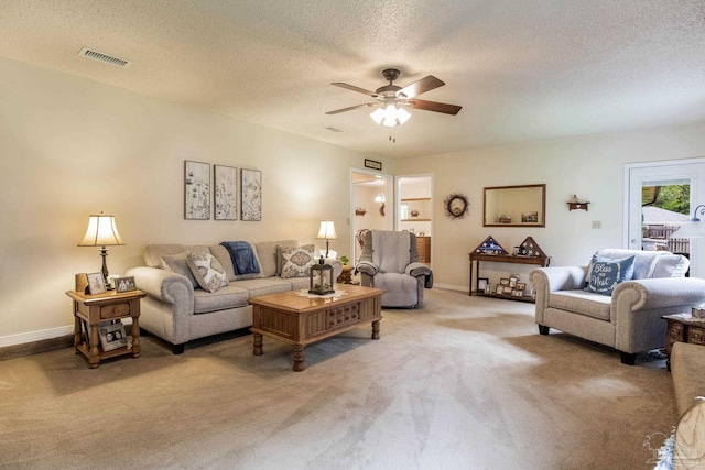 6028 Laurelwood Dr, Milton, FL 32570 - living area featuring light colored carpet, a ceiling fan, baseboards, and a textured ceiling