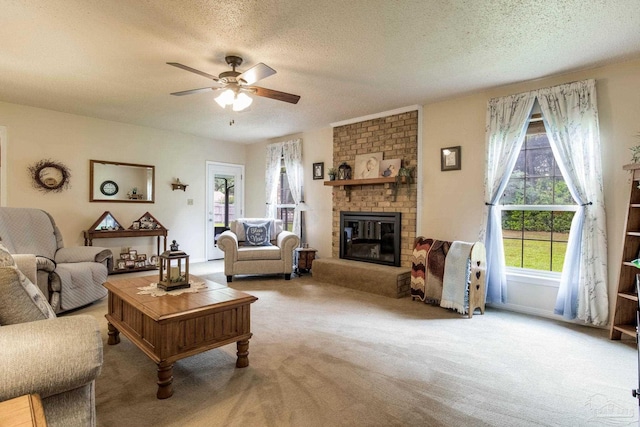 6028 Laurelwood Dr, Milton, FL 32570 - carpeted living room featuring a textured ceiling, ceiling fan, and a brick fireplace