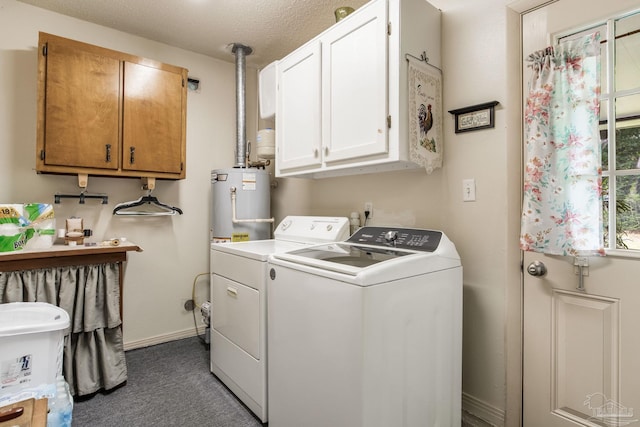 6028 Laurelwood Dr, Milton, FL 32570 - laundry room featuring washing machine and dryer, cabinet space, carpet floors, baseboards, and water heater