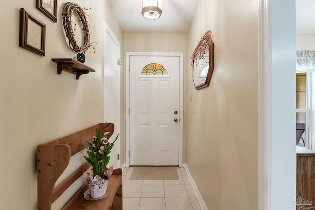 6028 Laurelwood Dr, Milton, FL 32570 - entryway with light tile patterned floors and baseboards