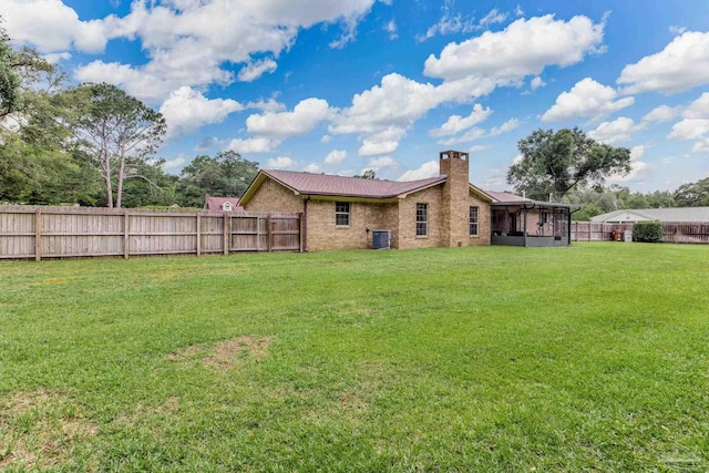 6028 Laurelwood Dr, Milton, FL 32570 - view of yard with a sunroom and central AC unit